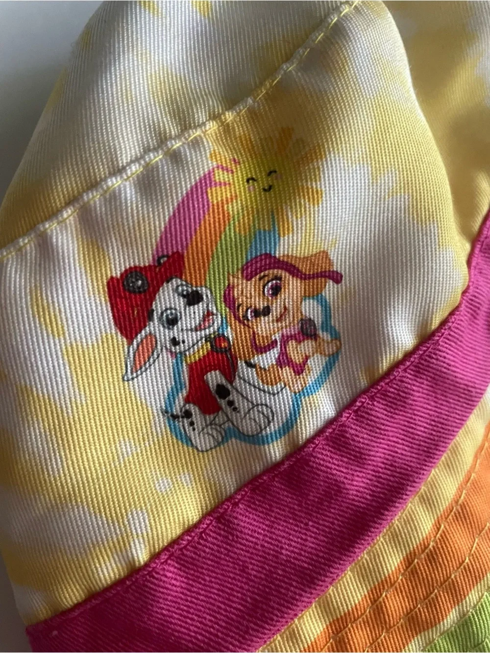 Paw Patrol Rainbow Stripe Reversible Bucket Hat in Yellow, Pink, Orange & Blue